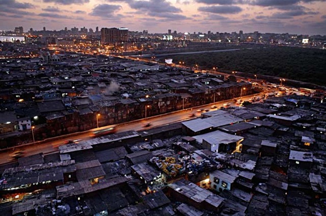 Dharavi by night with mangroves in the background
